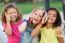 Group Of Childrens Using Mobile Phones In The Park