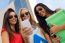 Three Girls Chatting With Their Smartphones At The Campus