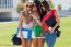 Three Girls Chatting With Their Smartphones At The Campus