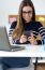 Confident Young Woman Working In Her Office With Mobile Phone