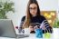 Confident Young Woman Working In Her Office With Mobile Phone