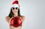 Sexy Santa Girl In Bikini Holding A Christmas Ball