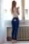 Young Beautiful Woman At Home With Mobile Phone In Back Pocket