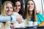 Three Young Women Having Coffee Break