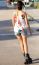 Young Woman With Roller Skate Riding In The Park