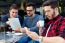 Outdoor Portrait Of Young Entrepreneurs Working At Coffee Bar