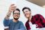 Two Young Entrepreneurs Taking A Selfie At Coffee Shop