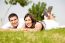 Beautiful Young Couple Lie Down On Grass