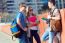 A Group Of Friends Talking In The Street After Class