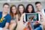 Group Of Friends Taking Photos With A Smartphone In The Street