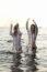 Two Women In The Water Splashing And Having Fun