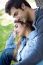 Outdoor Portrait Of Young Caucasian Couple At The Park