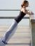 Young Woman Doing Push Ups Near The Sea