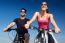 Happy Young  Couple On A Bike Ride In The Countryside