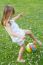 Happy Little Girl Playing Ball In The Park