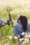 Young Woman With Mountain Bike Stretched On The Field