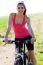 Fit Woman Riding Mountain Bike