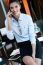 Cheerful Businesswoman Talking On Phone Standing In Her Office