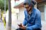 Modern Young Man With Mobile Phone In The Street