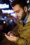 Portrait Of Young Man Using His Mobile Phone On The Street At Ni