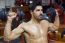 Young Man Doing Heavy Weight Exercise In Gym