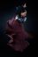 Young Flamenco Dancer In Beautiful Dress On Black Background