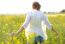 Beautiful Young Woman Enjoying Summer In A Field