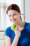 Young Woman Smiling Eating Apple