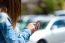 Mobile Phone In A Woman's Hand. Outdoor Image