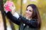 Beautiful Girl Taking A Selfie In Autumn