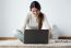 Beautiful Young Woman Working On Her Laptop At Home