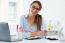 Pretty Young Woman Working In Her Office