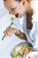 Woman Eating Salad At Home