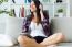 Beautiful Young Woman Listening To Music At Home