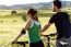 Happy Young  Couple On A Bike Ride In The Countryside