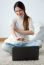 Beautiful Young Woman Working On Her Laptop At Home