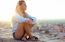 Beautiful Girl Sitting On The Roof And Listening To Music