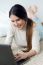 Beautiful Young Woman Working On Her Laptop At Home