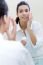 Body Care. Woman Applying Cream On Face