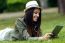 Beautiful Young Woman Using Digital Tablet In The Park