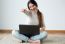 Beautiful Young Woman Working On Her Laptop At Home