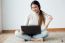 Beautiful Young Woman Working On Her Laptop At Home