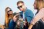 Portrait Of Group Of Friends Playing Guitar And Drinking Beer