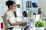 Pretty Young Woman Using Her Laptop In The Office