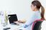 Pretty Young Woman Using Her Laptop In The Office