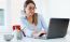 Pretty Young Woman Using Her Laptop In The Office