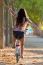 Pretty Young Girl Riding Bike In A Forest