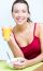 Young Woman Having Breakfast At Home