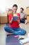 Young Couple With Digital Tablet Resting In Their New Home