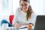 Pretty Young Woman Working In Her Office